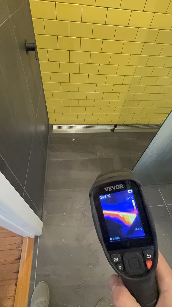 Thermal imaging used to trace a hidden bathroom leak without pulling up tiles.